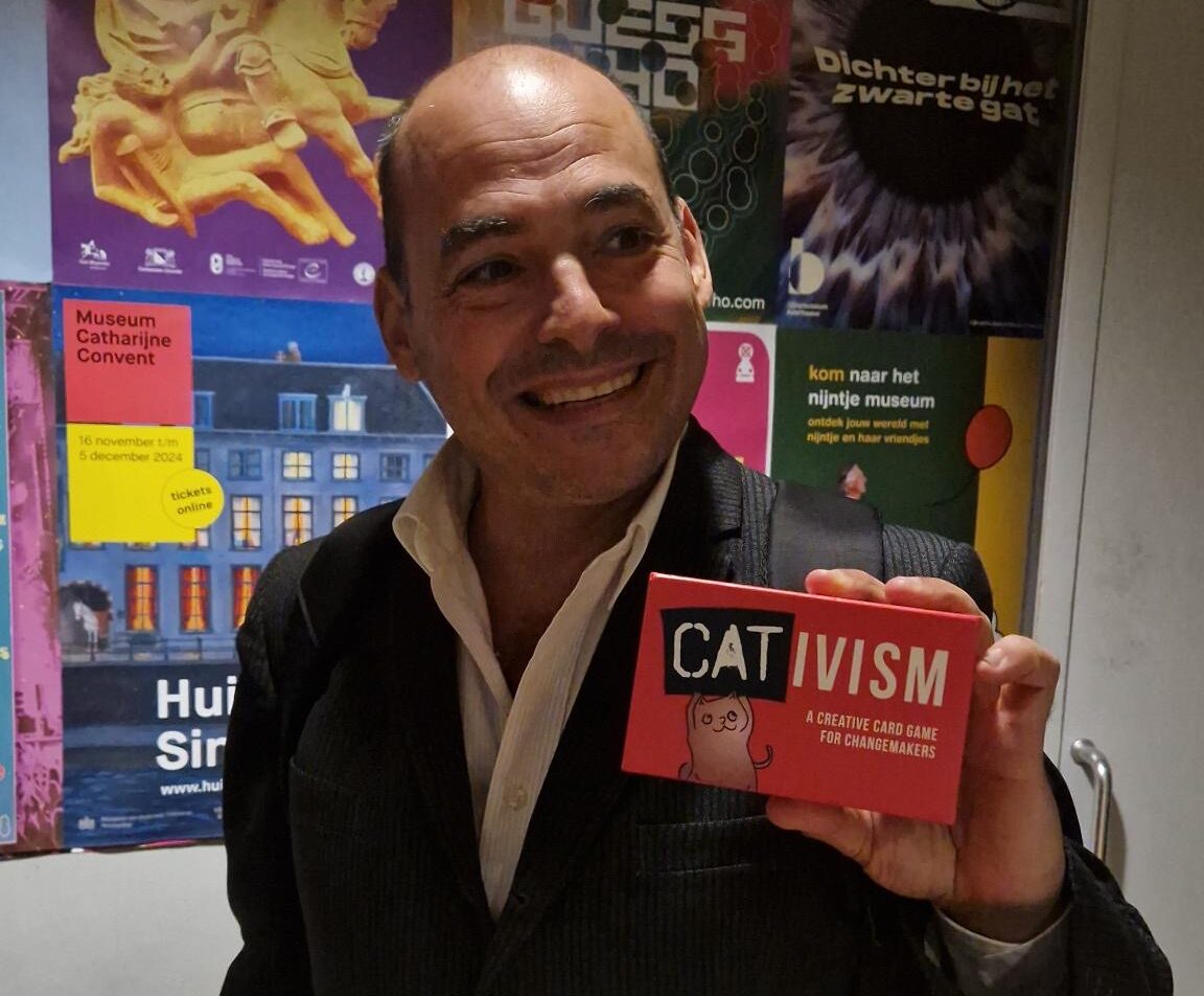 Mike Bonanno holding Cativism.